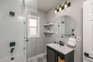 Bright bathroom with updated lighting and vanity cabinets